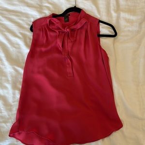 Sleeveless pink bow blouse